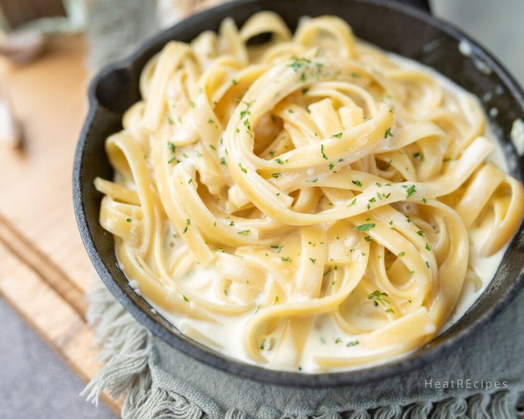 A creamy Cajun Alfredo sauce made with a mix of cheeses and cream cheese, rich in flavor with a spicy Cajun kick, perfect for dishes like Cajun pasta, chicken, or fish