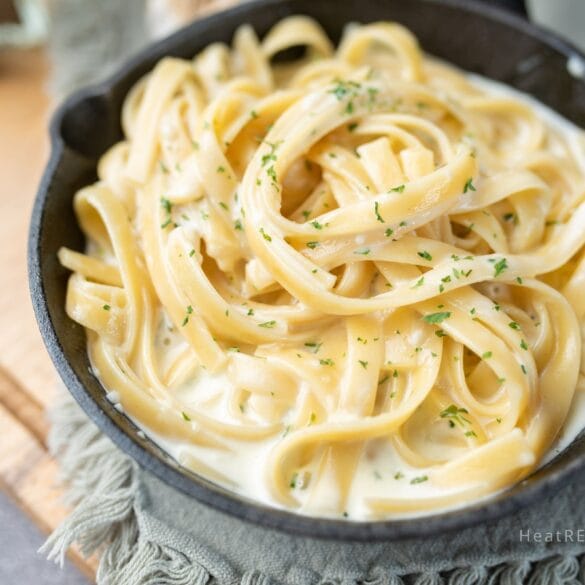 A creamy Cajun Alfredo sauce made with a mix of cheeses and cream cheese, rich in flavor with a spicy Cajun kick, perfect for dishes like Cajun pasta, chicken, or fish