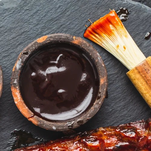 Bourbon sauce ingredients including bourbon, brown sugar, soy sauce, and garlic